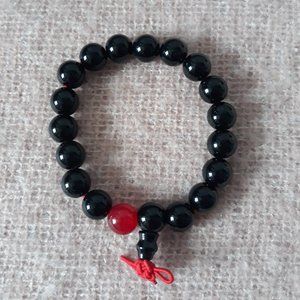 Beaded Zen Bracelet -- Black Beads (with one Red Bead) on Red Elastic